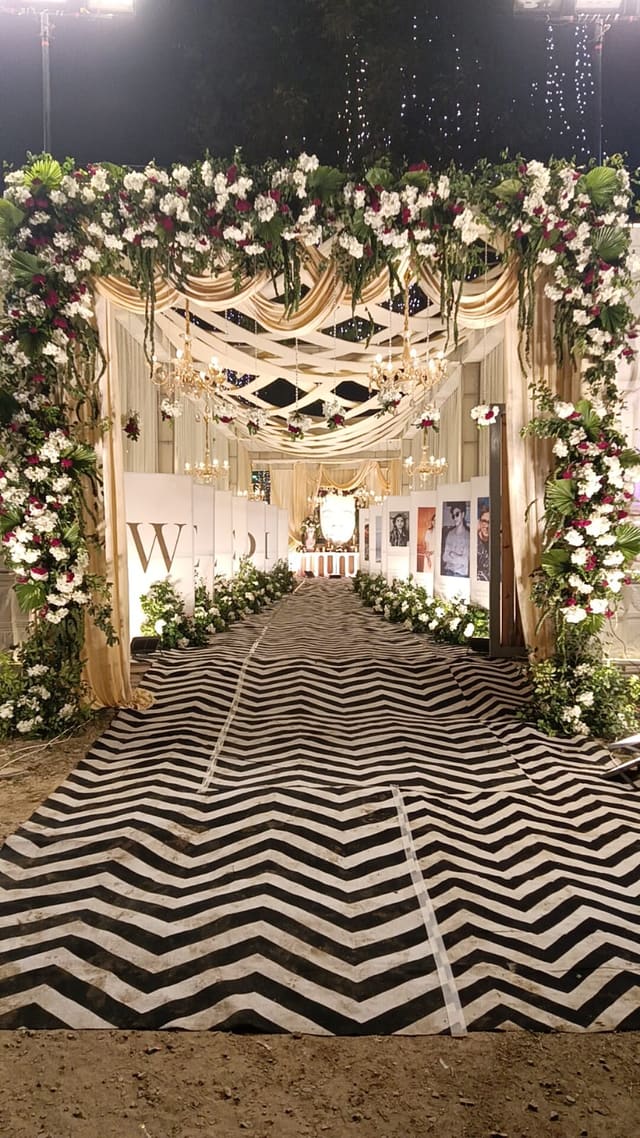 Floral wedding arch entrance with monogram