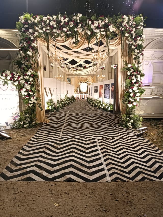 Floral wedding entrance arch decorated for a ceremony